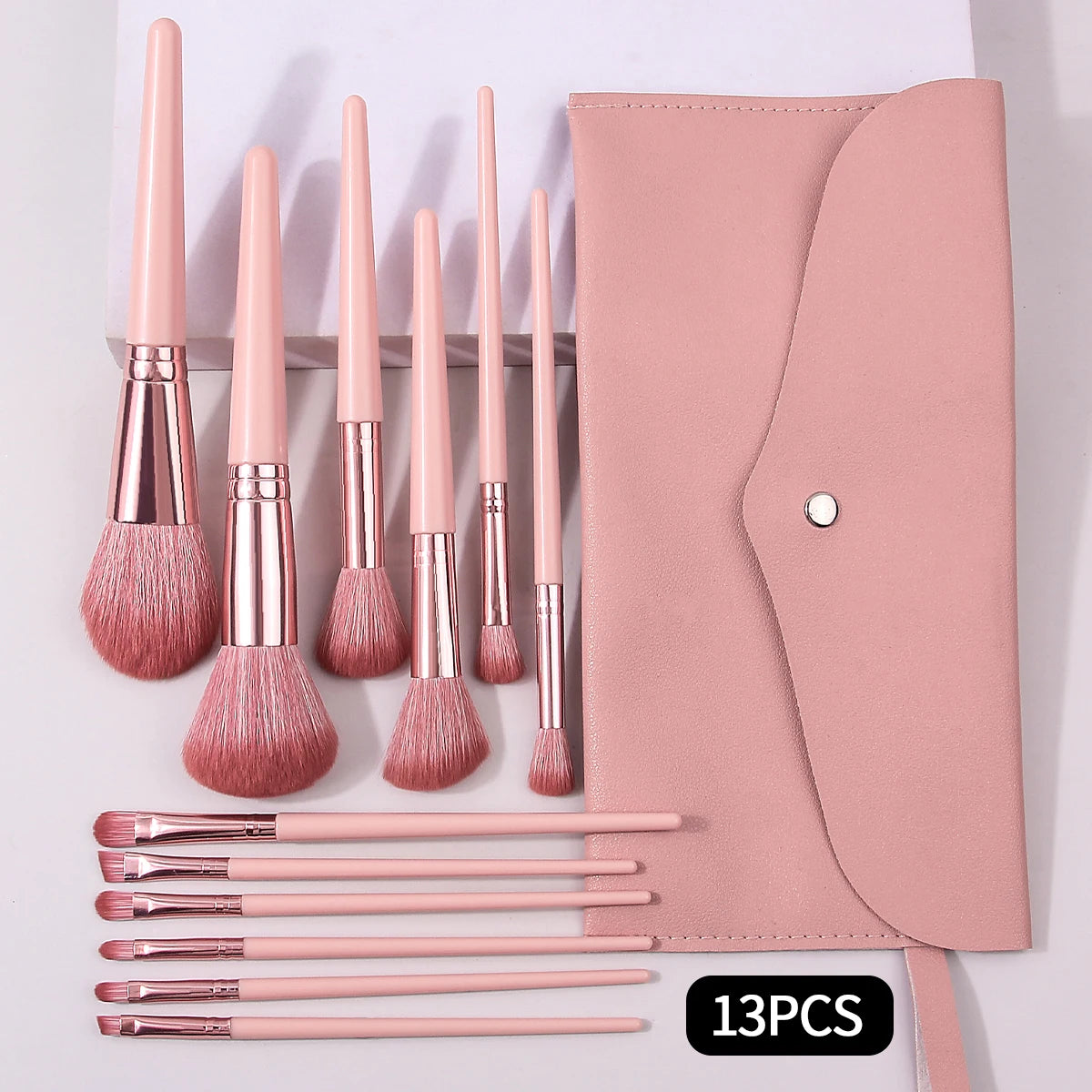 13pcs makeup brush set comes with a portable envelope, makeup brush bag, blush, loose powder and eyeliner brushess
